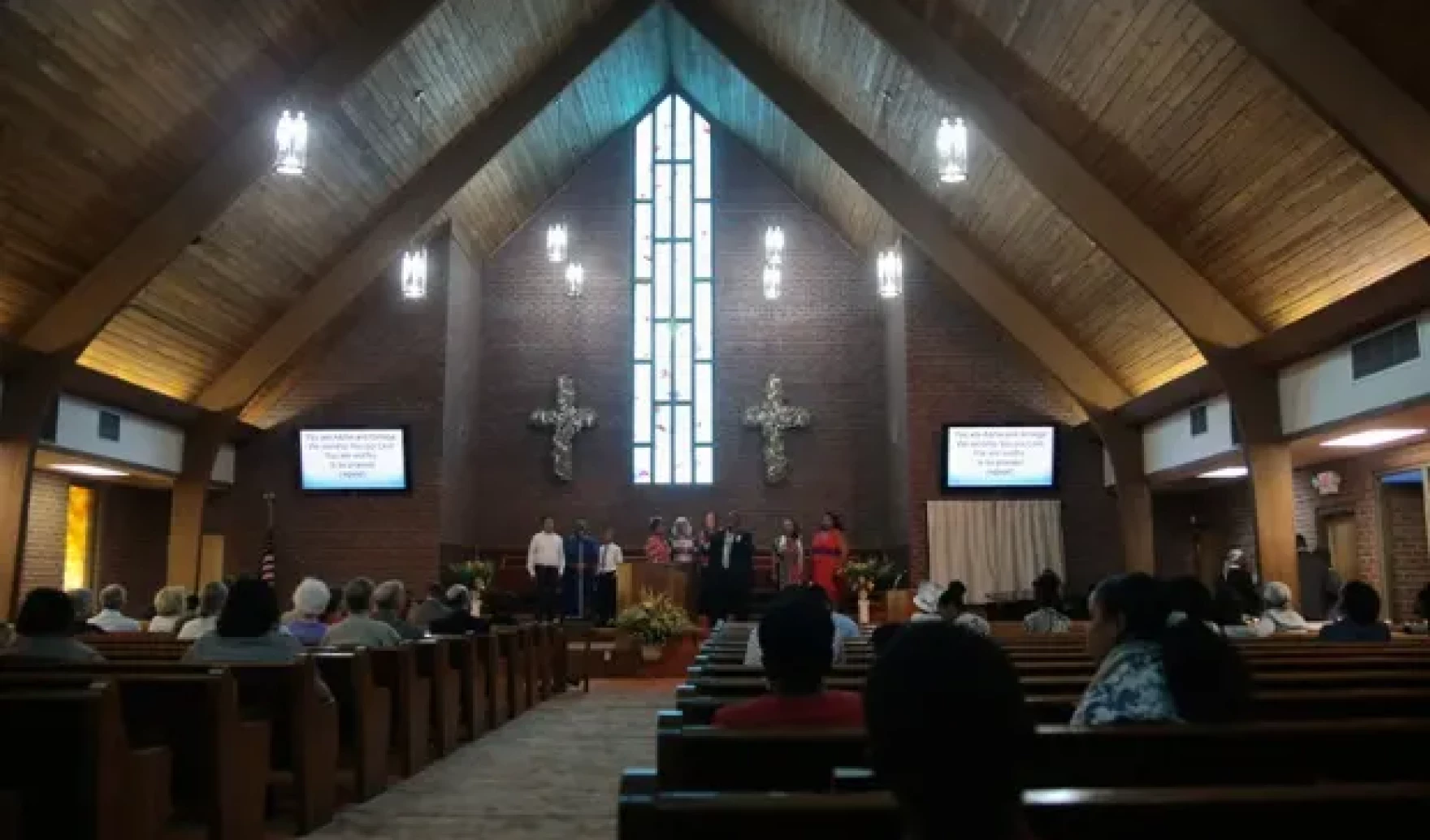 a worship service in a traditional wooden sanctuary